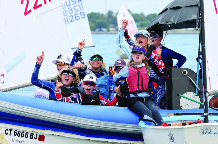 youth sailors on sailing dinghy